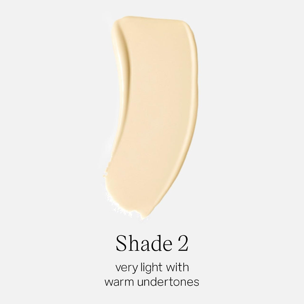 Saie Glowy Super Skin Tint being pumped to reveal a light, luminous finish.