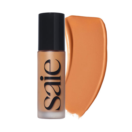 Saie Glowy Super Skin Tint bottle cap close-up highlighting a luminous finish.