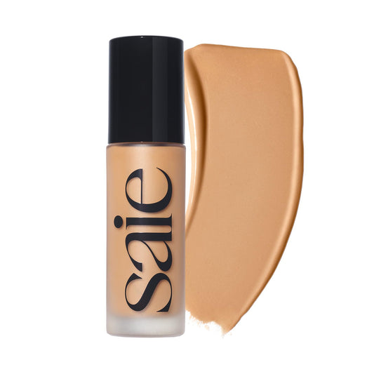 Saie Glowy Super Skin Tint bottle pour for a dewy look.
