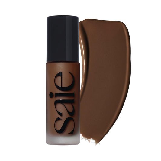 Saie Glowy Super Skin Tint bottle pour showing weightless hydration