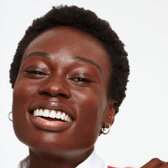 Saie Glowy Super Skin Tint on hand shows easy blend.
