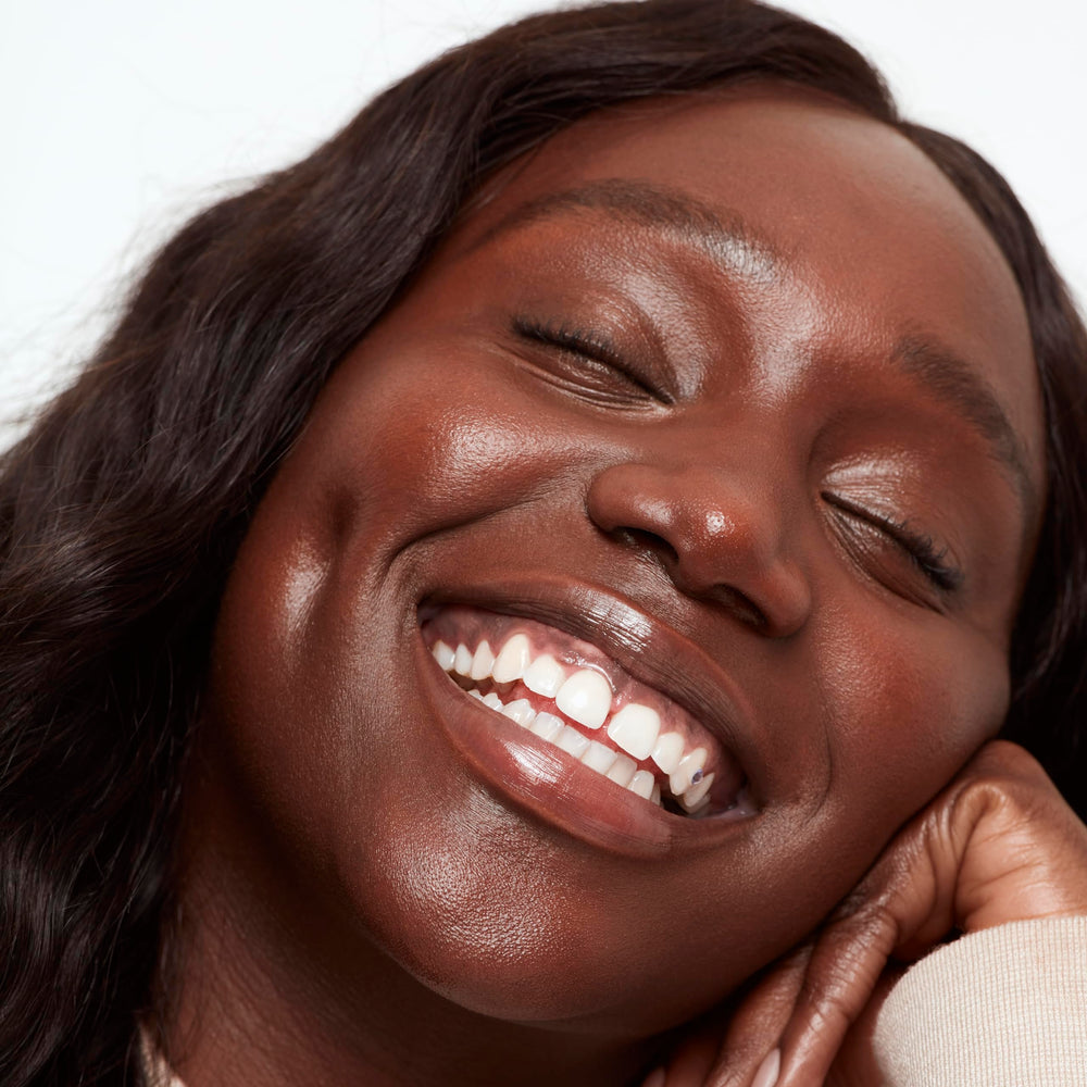 Saie Glowy Super Skin Tint swirl activation image highlights seamless skin-like finish.