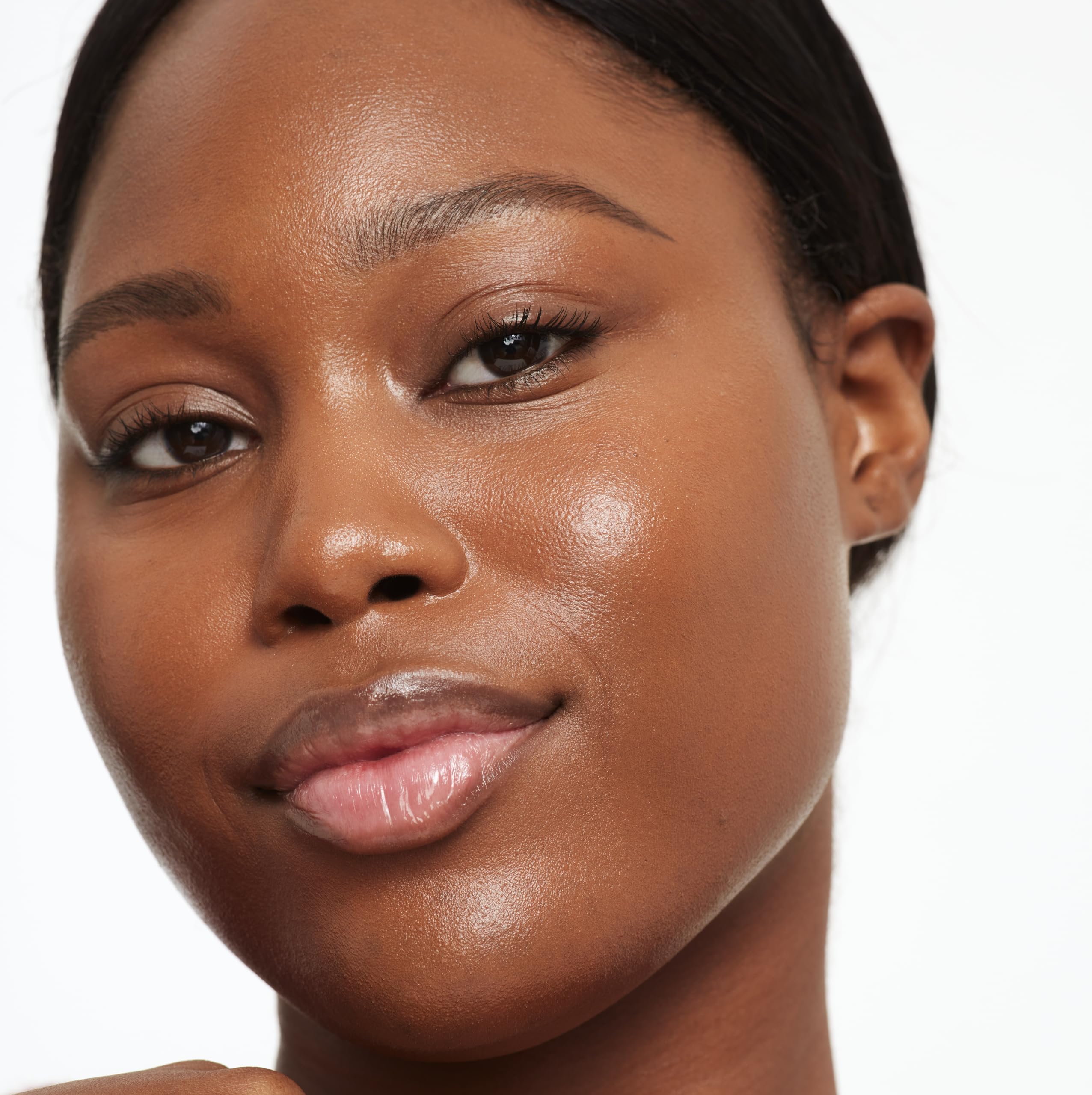 Saie Glowy Super Skin Tint swirled on skin showing medium coverage.
