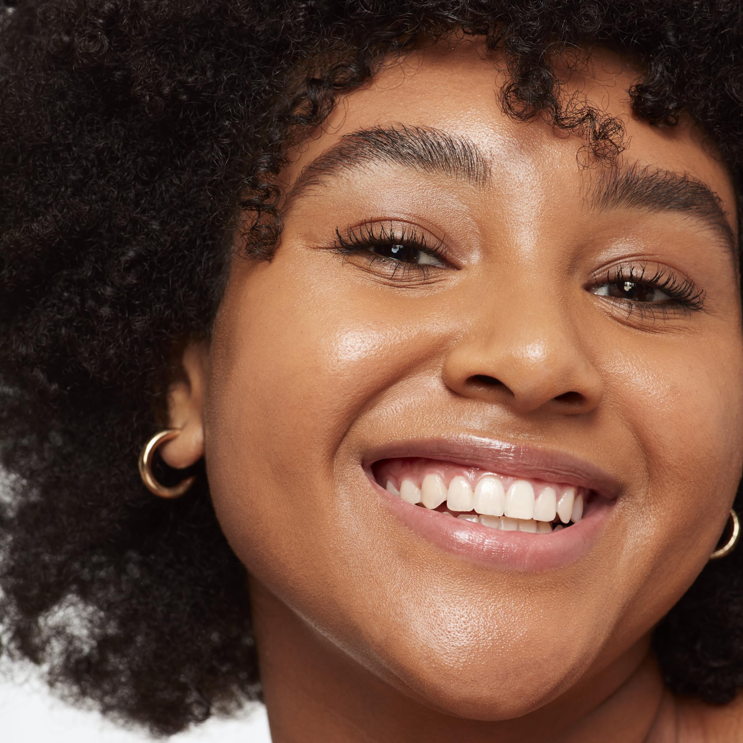 Saie Glowy Super Skin Tint swirl texture reveals radiant, skin-like glow.