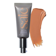 Saie Slip Tint SPF 35 applied for dewy, natural glow on the face.