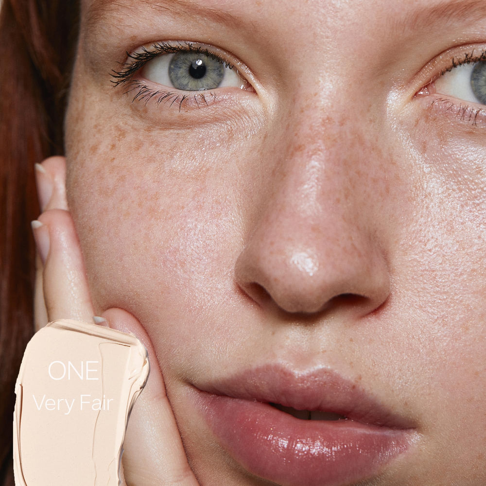 Saie Slip Tint swatch on arm demonstrates light, natural coverage