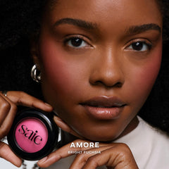 Saie SuperSuede baked blush swatch-on-cheek showing natural flush