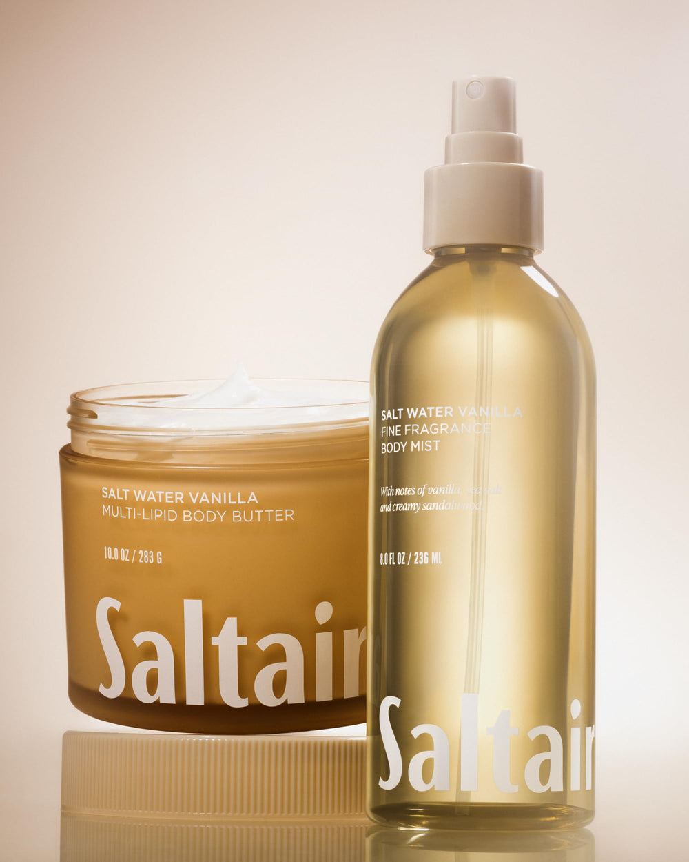 Saltair packaging and two 8oz bottles in lifestyle setting.