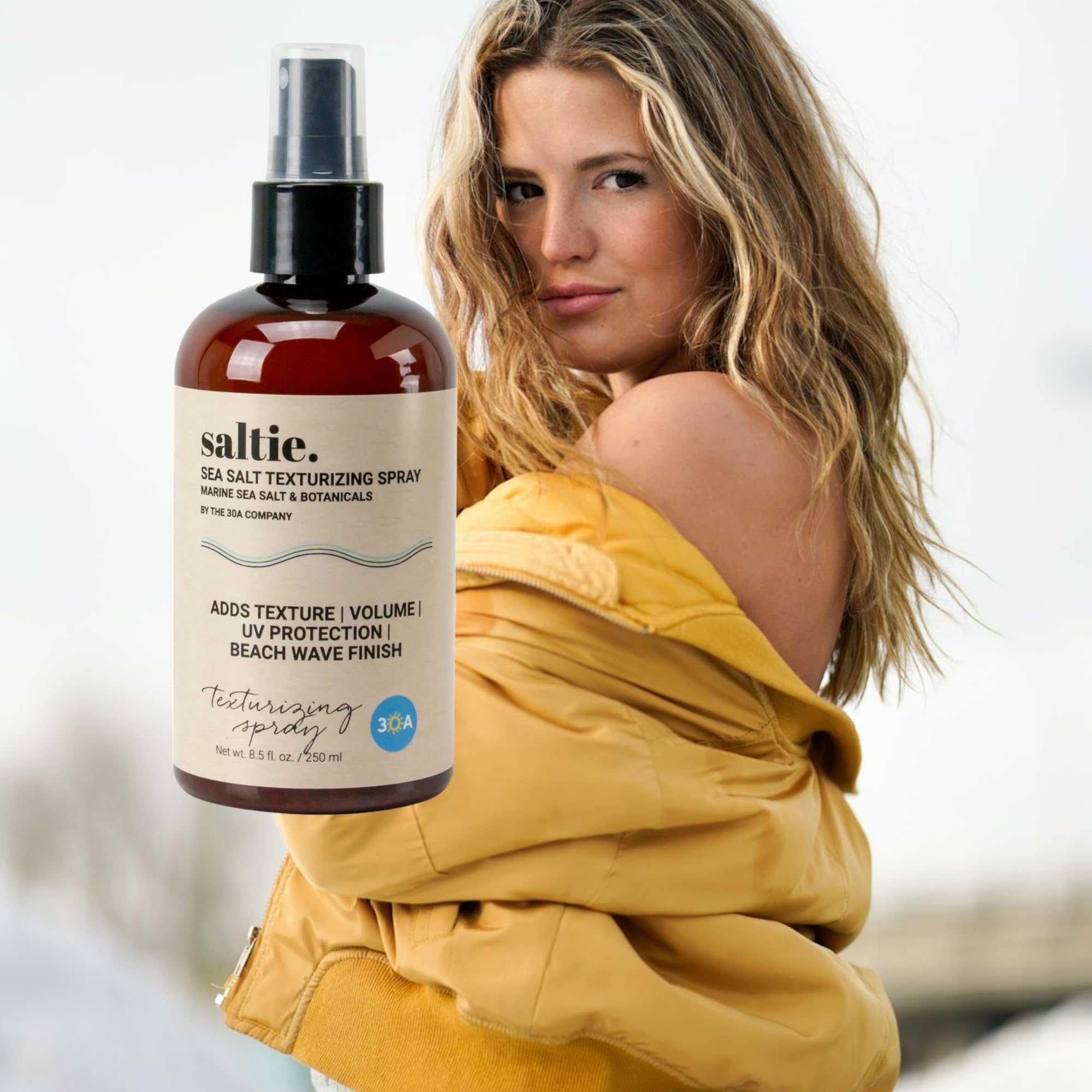 Saltie by 30A Sea Salt Texturizing Spray packaging close-up showing sleek design.