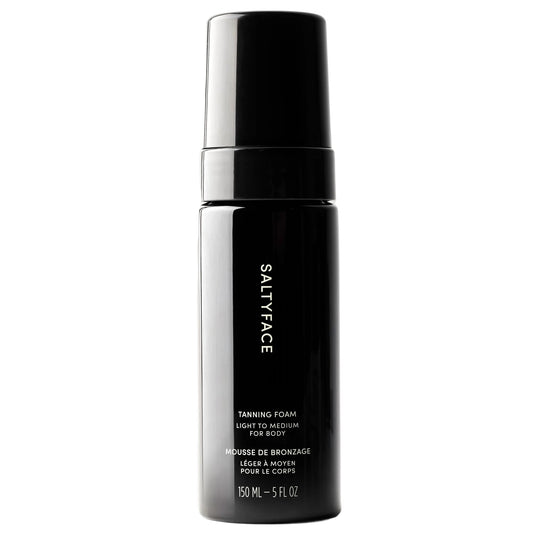 Saltyface tanning foam bottle in light-to-medium shade for an even, transfer-free glow.