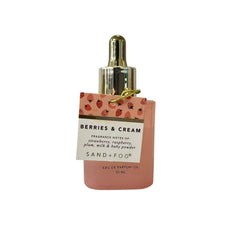 Close-up of Sand + Fog Berries & Cream EDP Oil dropper in portable 50ml packaging.