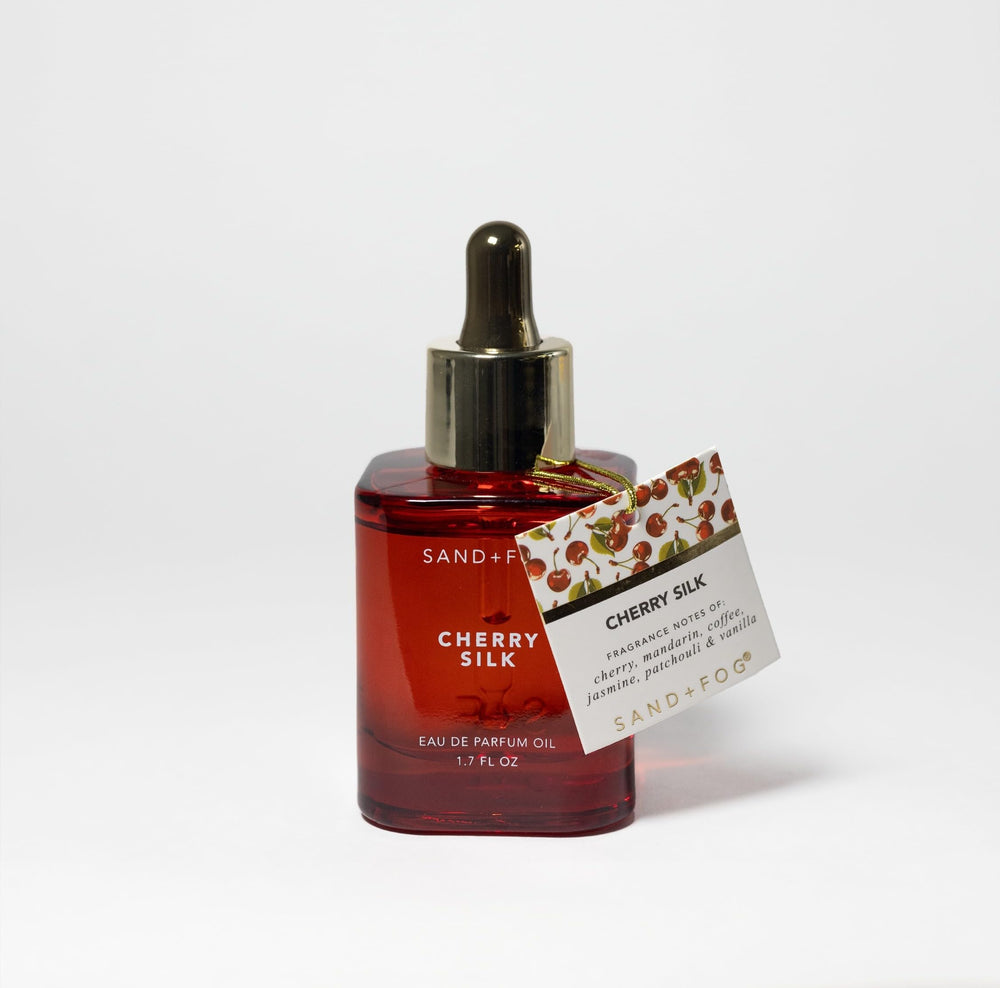 Sand + Fog Cherry Silk bottle showcases premium parfum oil for long-lasting fragrance