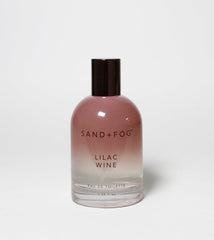 Sand + Fog Lilac Wine EDT bottle with a gradient mauve-to-clear design, ideal for daily wear.