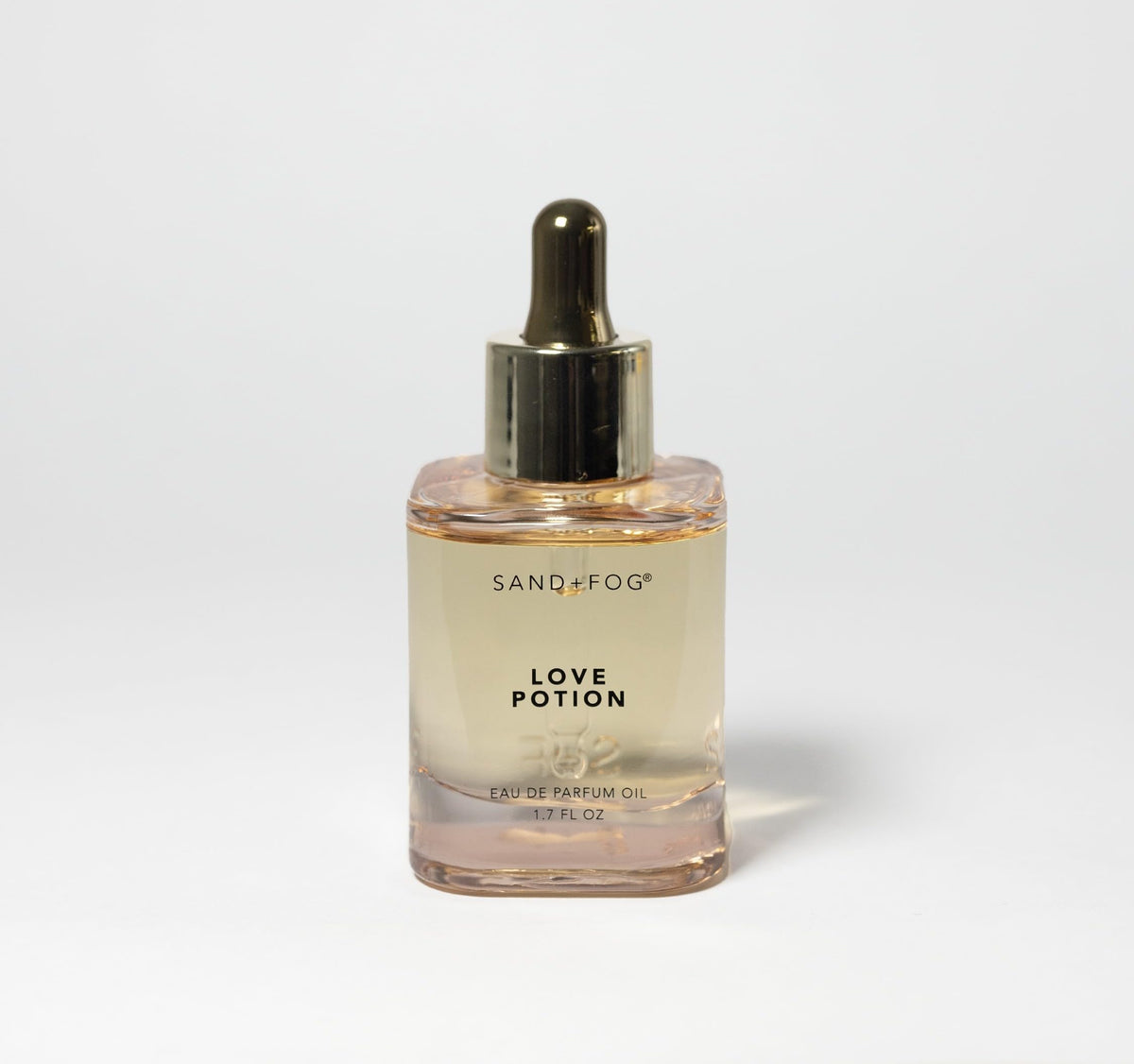 Sand + Fog Love Potion bottle close-up, highlighting premium glass and dropper for precise use