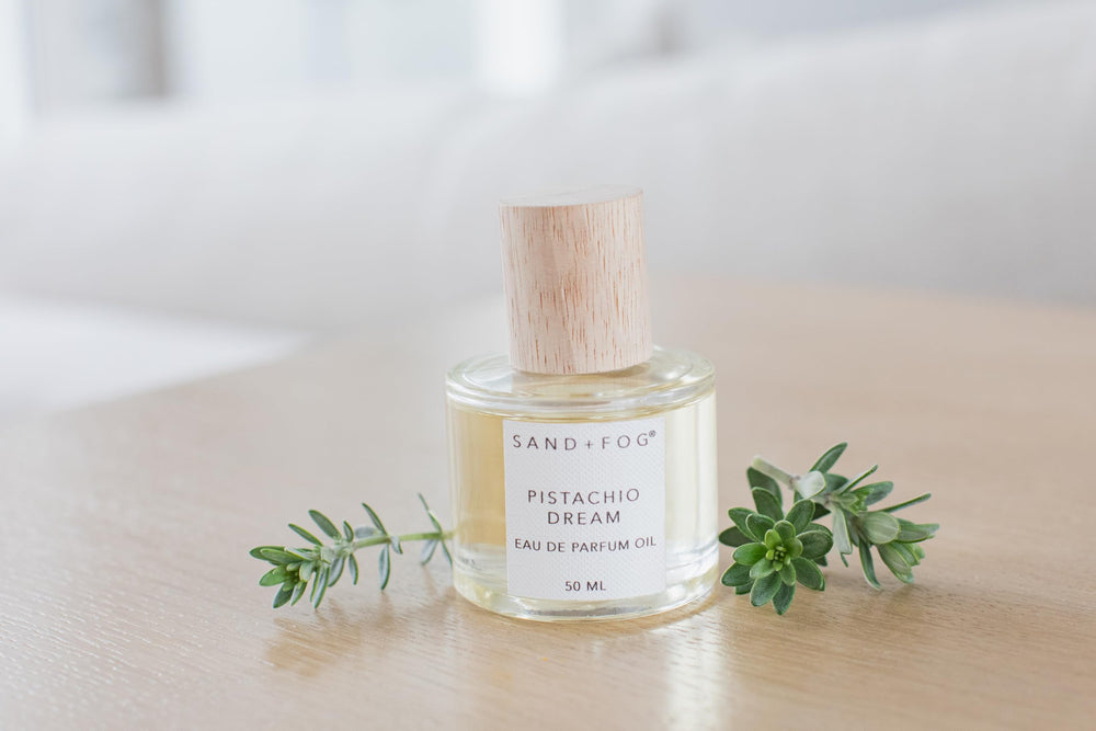 Sand + Fog Pistachio Dream rollerball on skin for lasting aroma