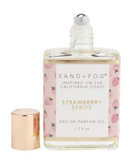 Sand + Fog Strawberry Spritz rollerball, portable design for travel-friendly application.