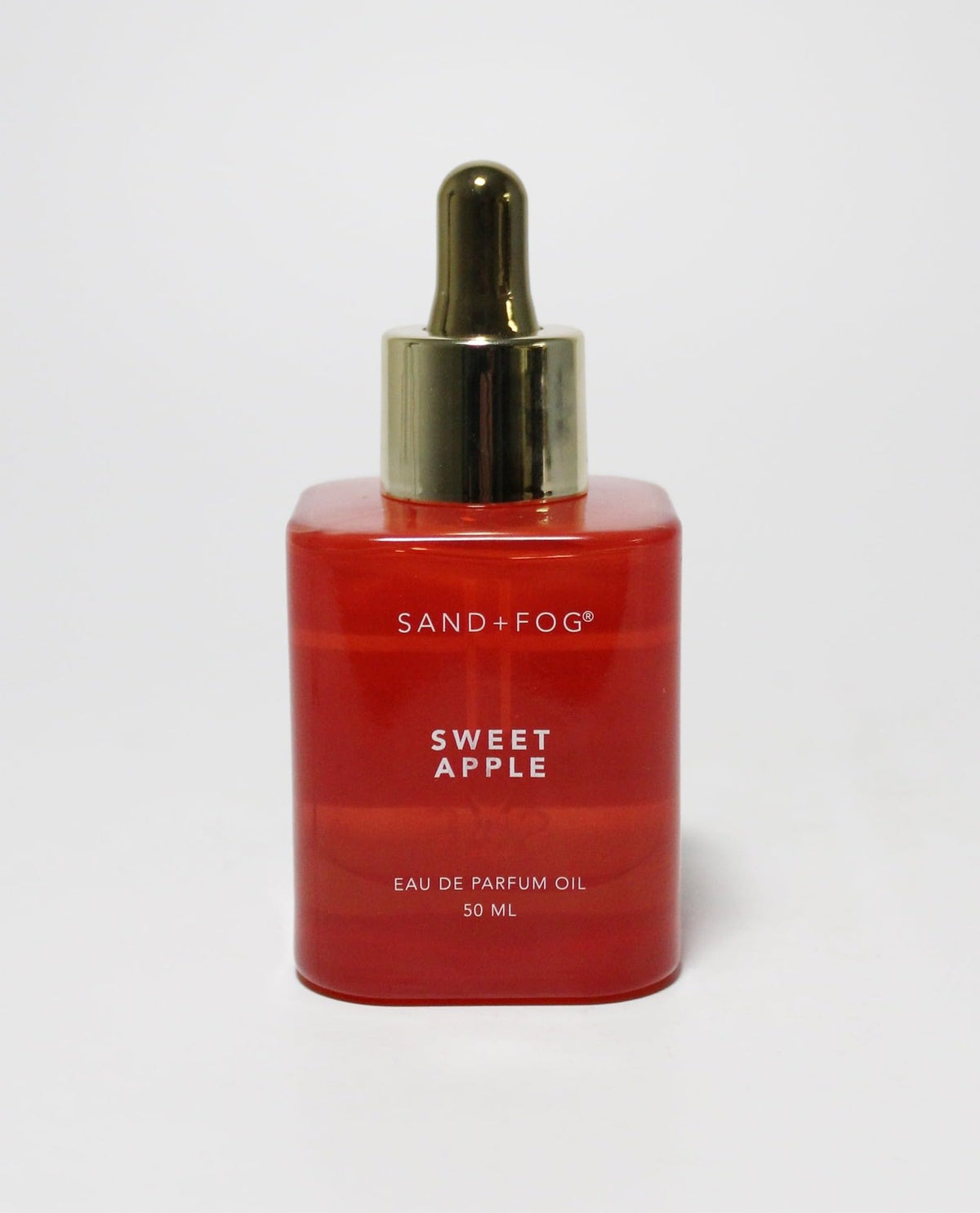 Sand and Fog Sweet Apple perfume oil bottle with dropper for precise application and long-lasting wear.