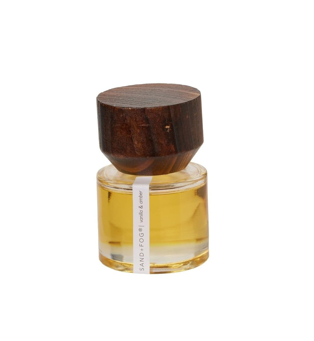 Sand + Fog vanilla and amber perfume oil bottle with wooden cap for precise roll-on application