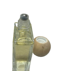 Sand + Fog Vanilla Musk roll-on application on pulse points for precise, on-the-go fragrance touch-ups