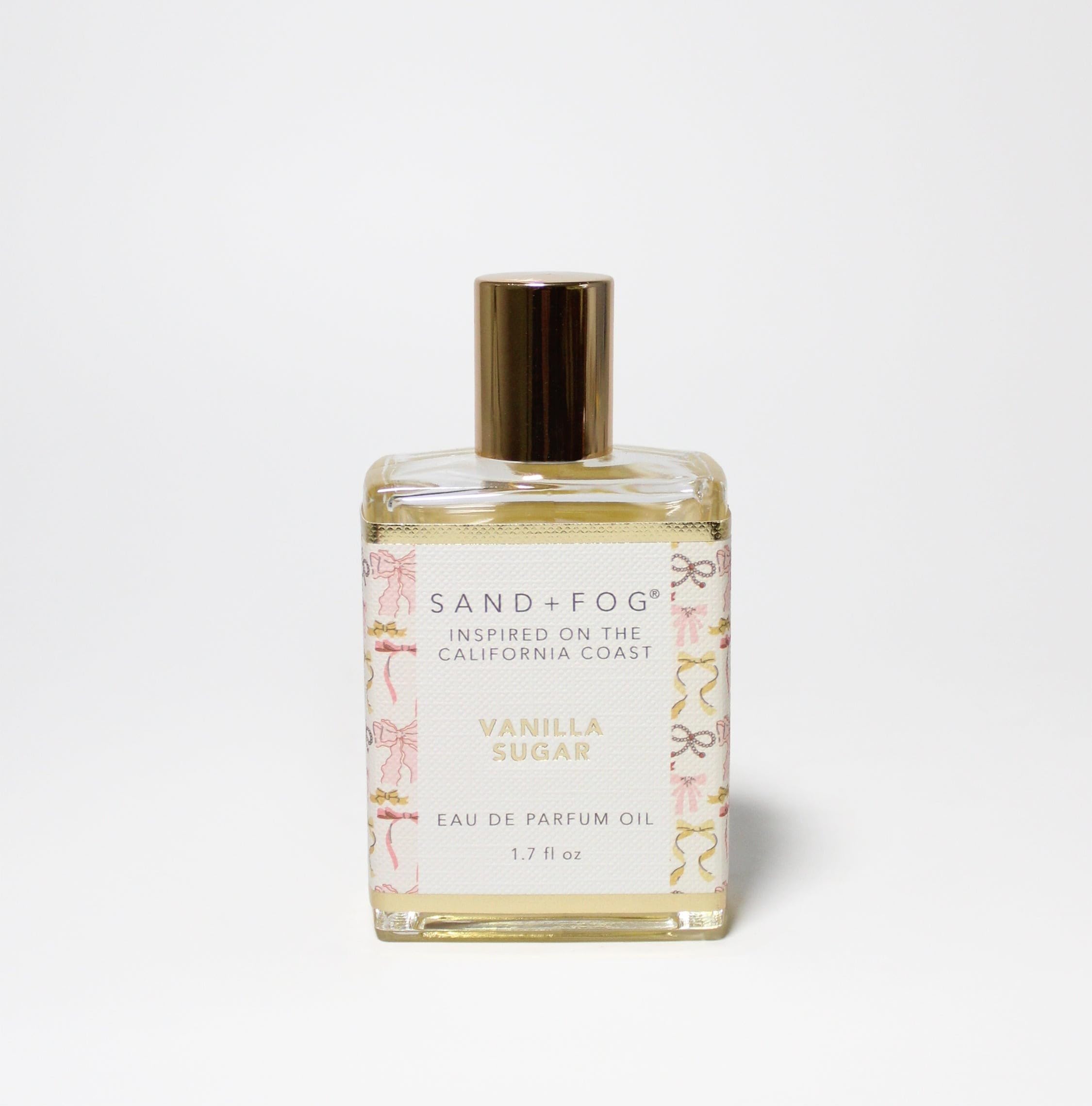 Sand + Fog Vanilla Sugar bottle with pink and gold accents, elegant coastal fragrance.
