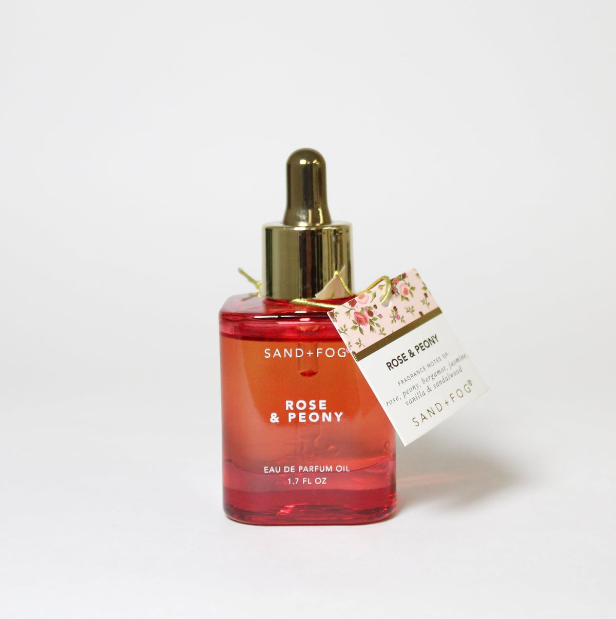 Sand and Fog Rose and Peony perfume oil bottle with gold dropper cap for precise layering.