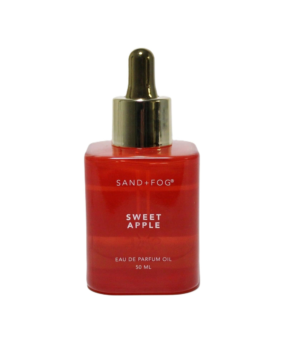 Sand + Fog Sweet Apple Oil in a red bottle with a gold dropper cap, long-lasting fragrance.