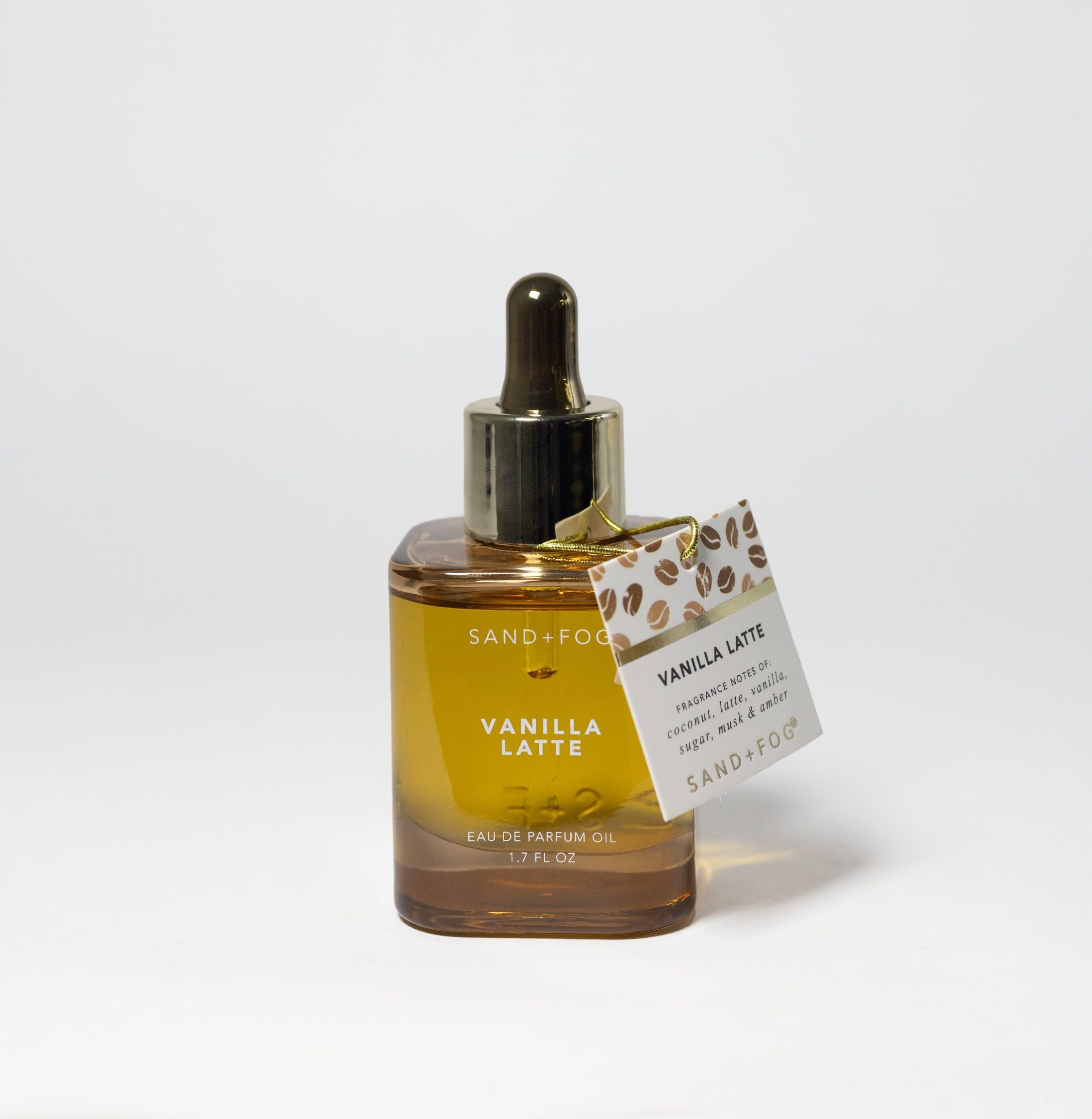 Sand + Fog Vanilla Latte parfum oil bottle on a vanity with long-lasting fragrance.
