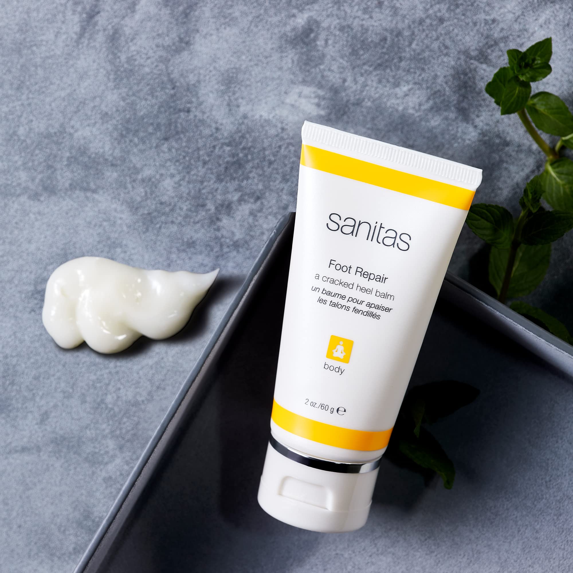 Applying Sanitas Foot Repair balm to rough heel area