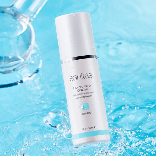 Close-up of the gel texture of Sanitas Glycolic Citrus Cleanser exfoliating to reveal a clearer complexion.