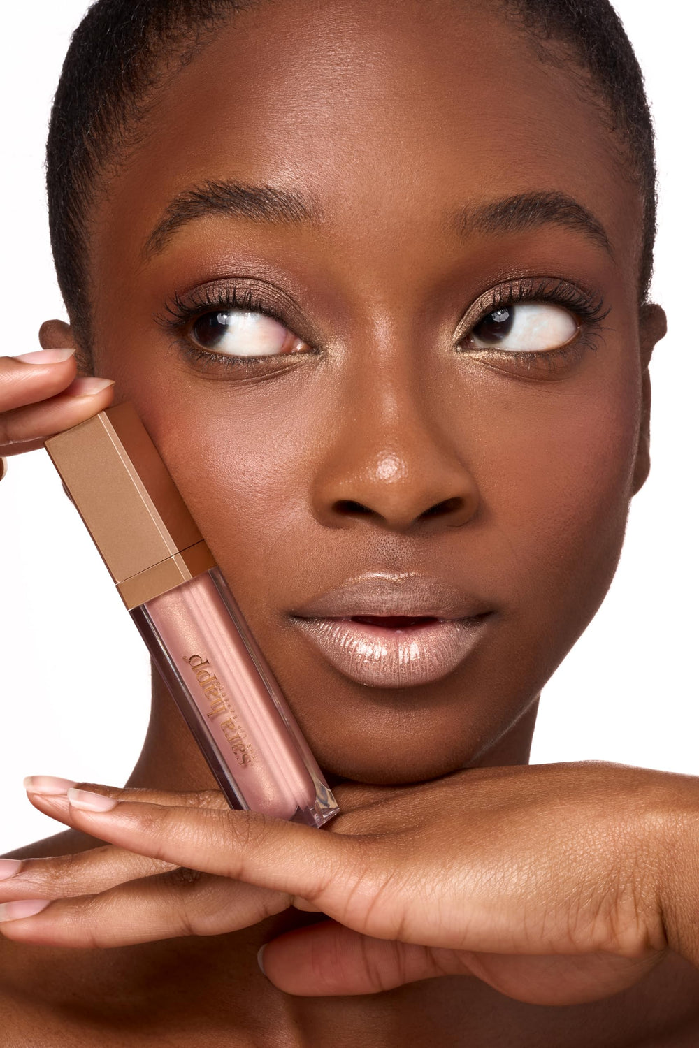 Shimmer detail on Sara Happ Rose Gold Slip Luxe Gloss for premium lip look
