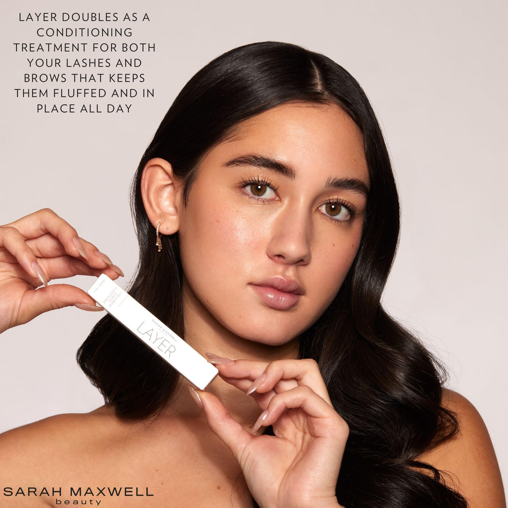 Sarah Maxwell LAYER applicator brush applying serum to lashes