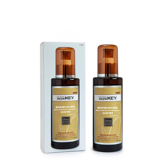 Saryna Key Repair Oil bottle close-up highlighting shine boost for hair