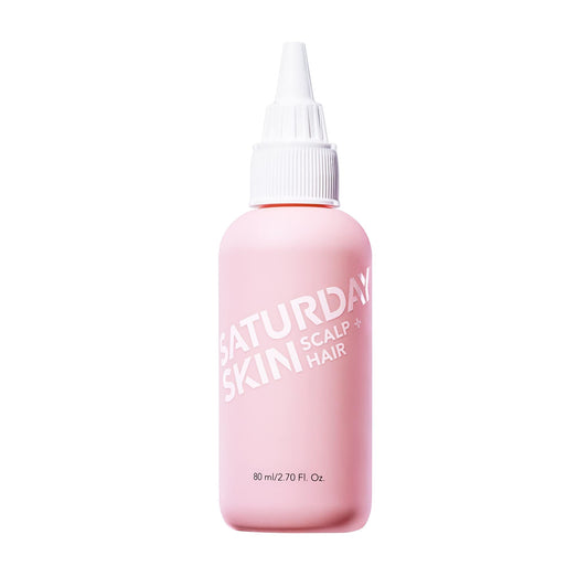 Saturday Skin bottle closeup showing a lightweight serum that invigorates the scalp.
