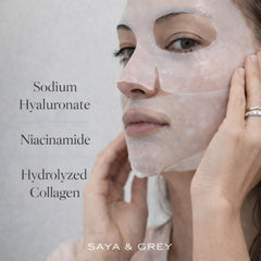 Saya & Grey Hydro Cera-Nol mask sheet in hand, showcasing portable hydration.
