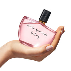 SCENT BEAUTY Kylie Minogue Darling EDP heart notes reveal soft lilies for a graceful bloom.