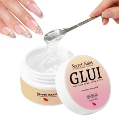Secret Nails GLUI bottle closeup highlights premium bond formula for reliable press-on nails.
