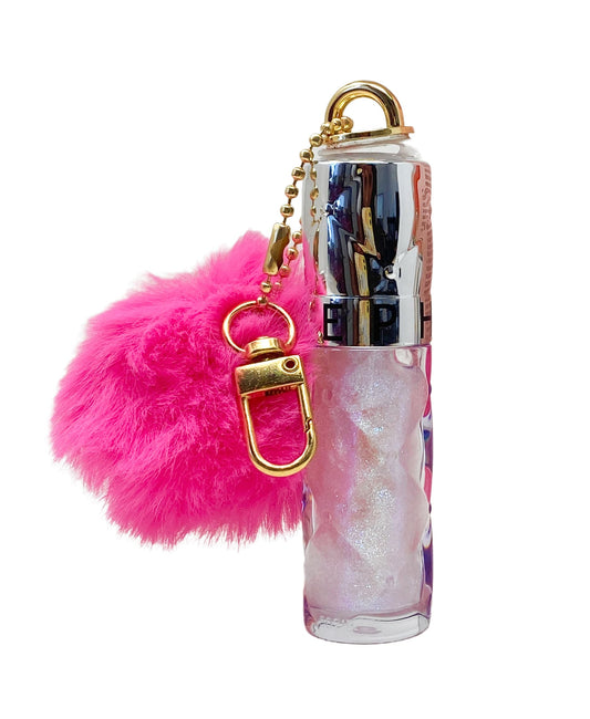 SEPHORA Outrageous Ornament Cosmic Kiss gloss swatch shows rich color with glossy finish.