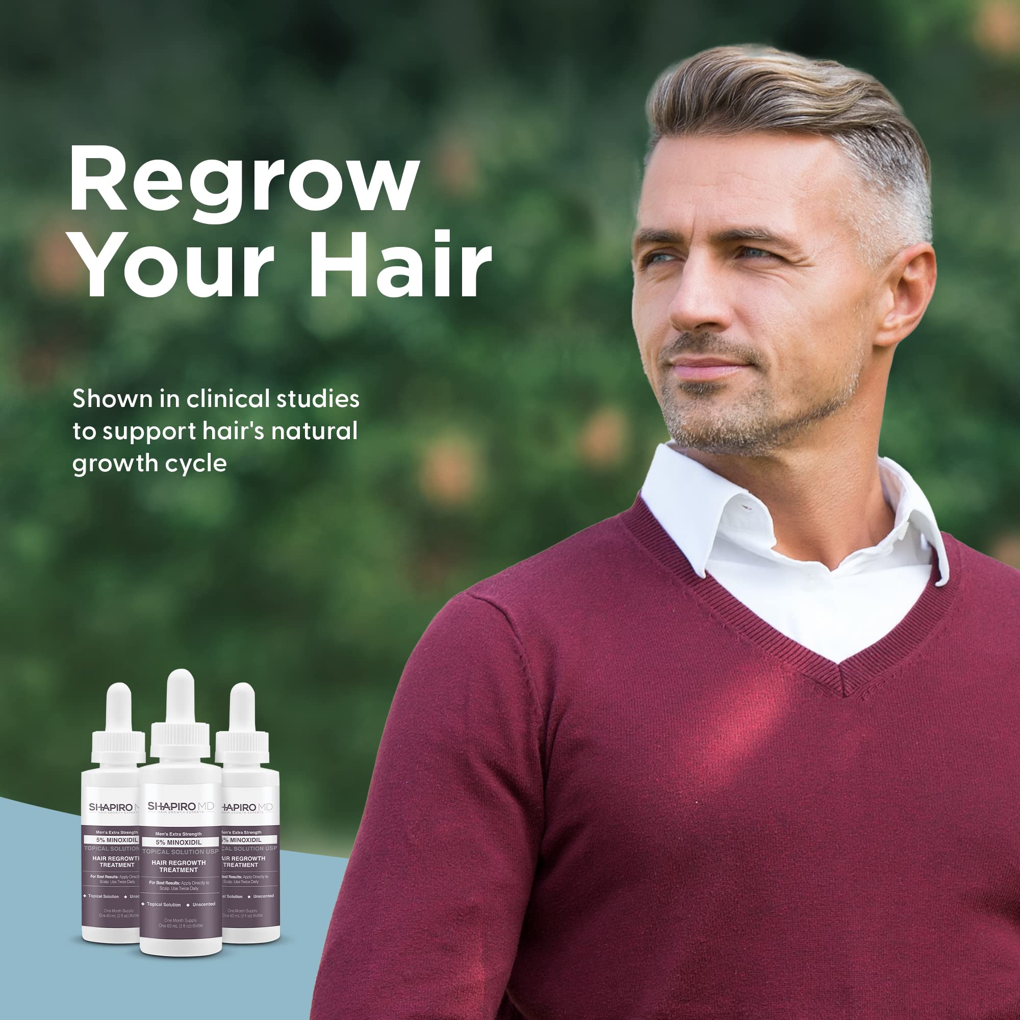 Close-up of the dropper ready to apply Minoxidil to the scalp.
