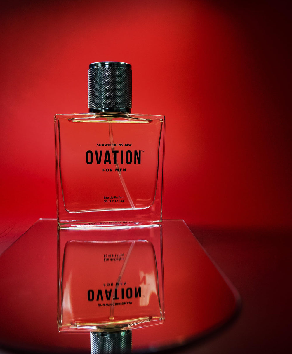 Shawn Crenshaw Ovation for Men on warm wood panel, amber and vanilla hues.