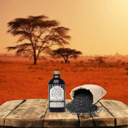 Dropper of Shea Terra Ethiopian Black Seed Oil, may nourish the scalp
