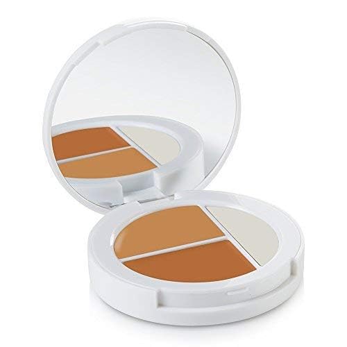 Sheer Cover Studio Conceal & Brighten Trio light concealer for smooth blending.