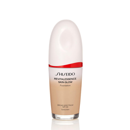 Shiseido RevitalEssence Foundation bottle close-up showing luminous glow and hydration.
