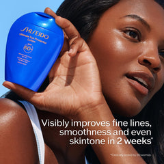Shiseido Ultimate Sun Protector Lotion being applied to the neck for easy, lightweight coverage.