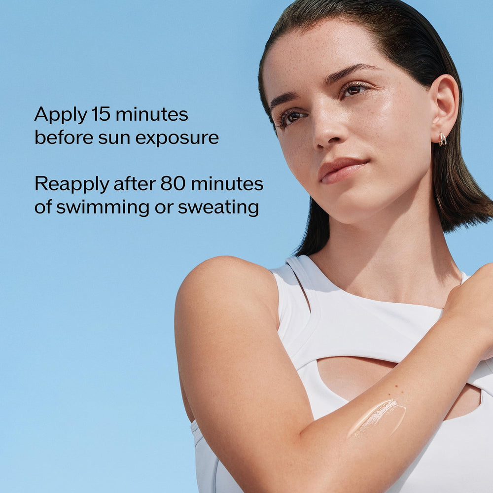 Shiseido Ultimate Sun Protector Lotion under water splash illustrating water resistance.