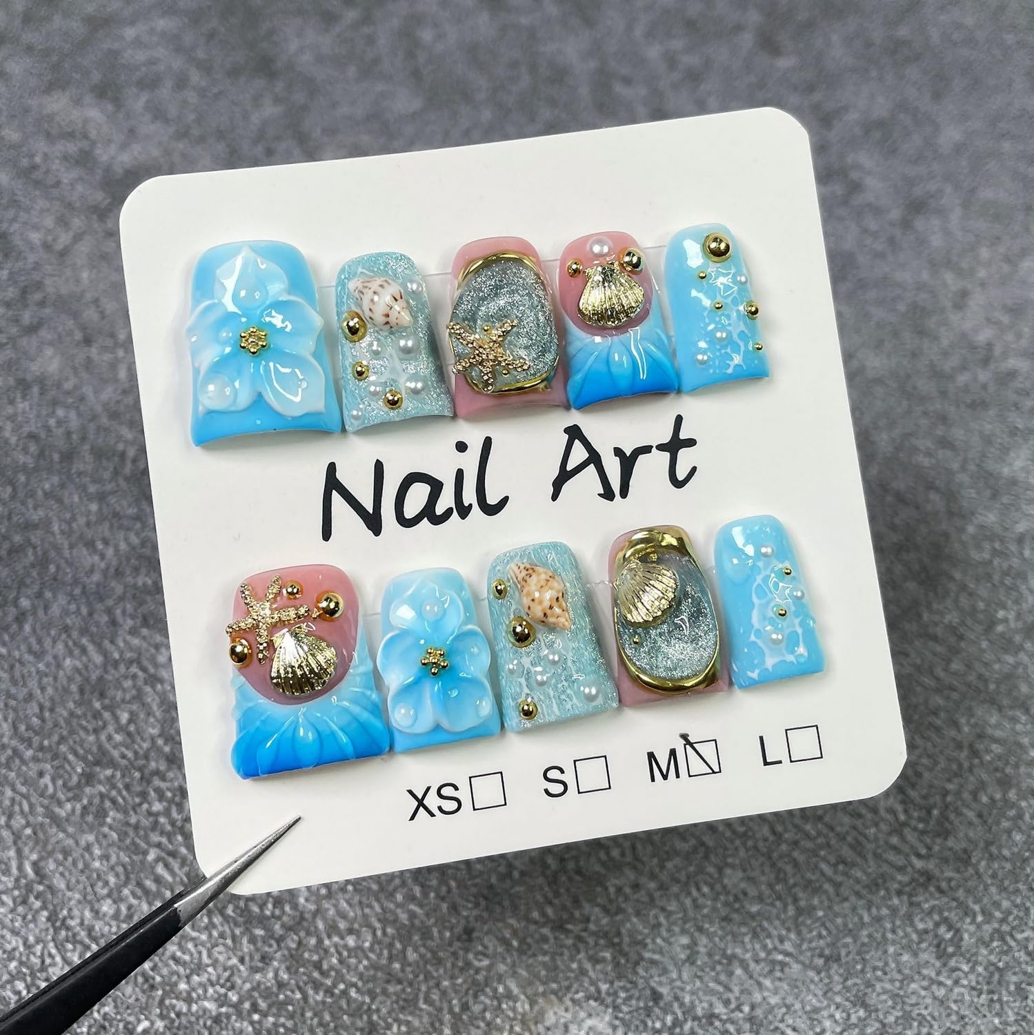 Short Duck handmade press-on nails with golden starfish and shell accents for glam occasions.