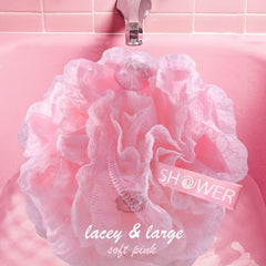 Shower Bouquet loofah with long ribbon handle for easy drying and storage.