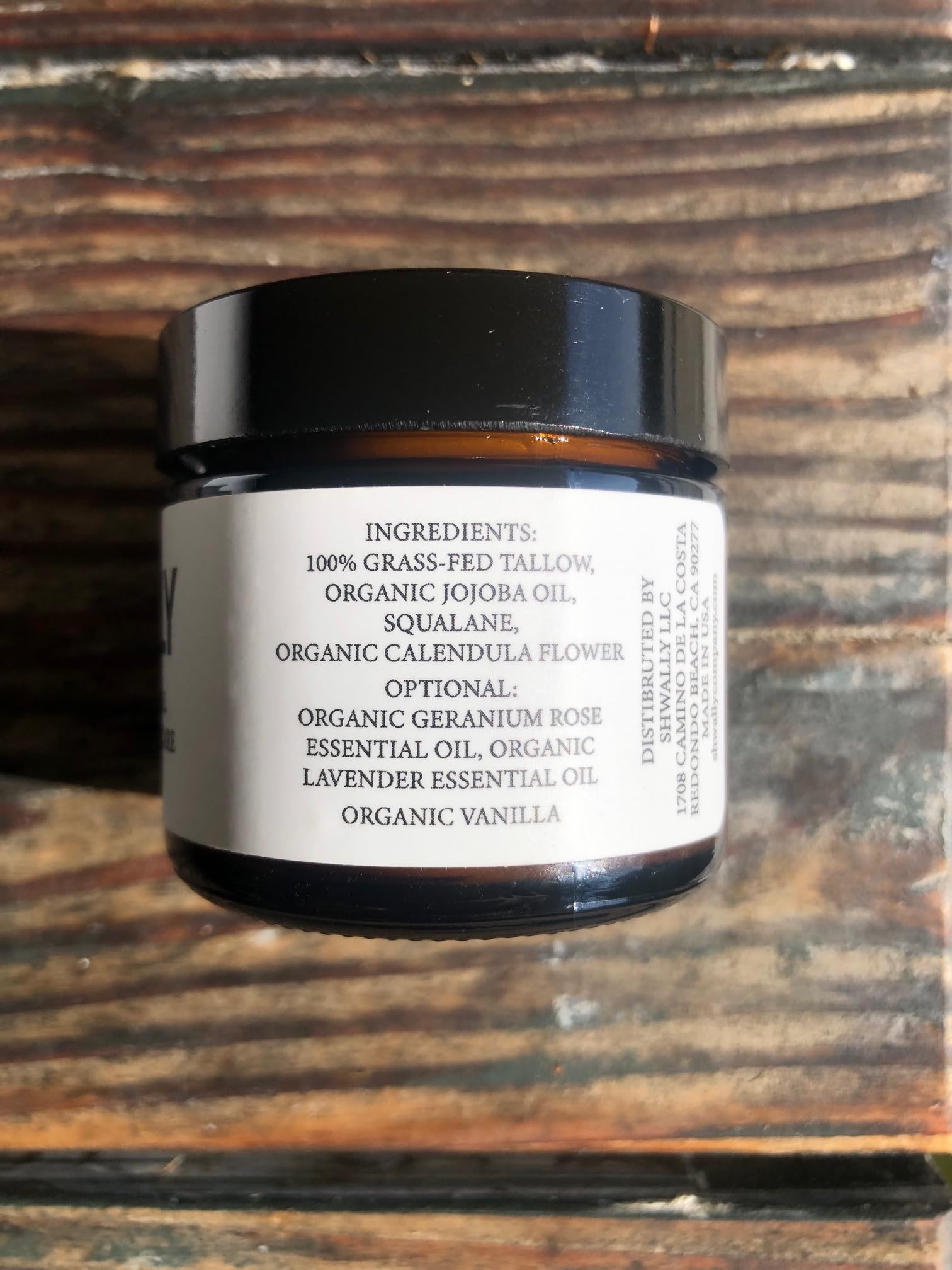 Closeup of jar lid and product texture in Shwally balm for natural ingredients
