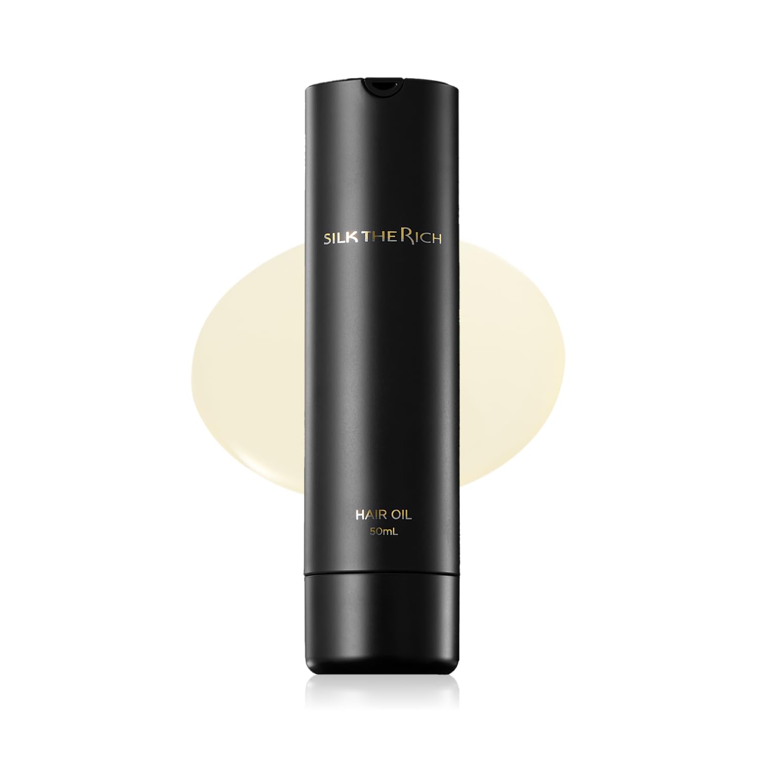 SILK THE RICH hair oil bottle demonstrating heat protection in styling.