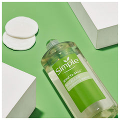 Simple Micellar Cleansing Water cotton pad application showing makeup removal in one step