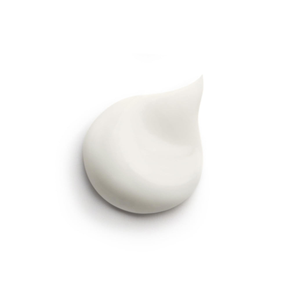 Sisley Paris Ecological Compound fluid texture application shows lightweight, non-greasy hydration.